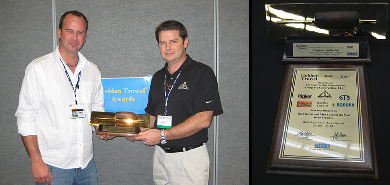 Owner holding Golden Trowel Award